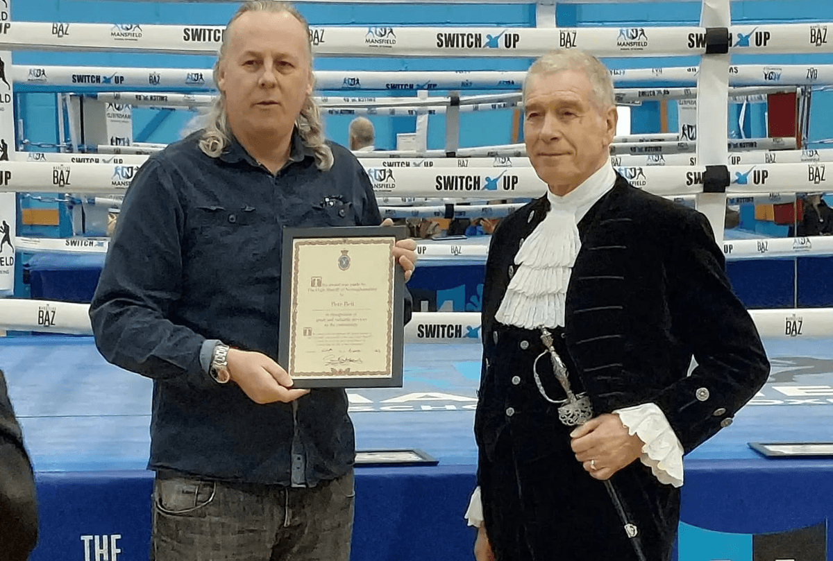 Pete Bell receiving his High Sheriff of Nottinghamshire Award from High Sheriff Paul Southby
